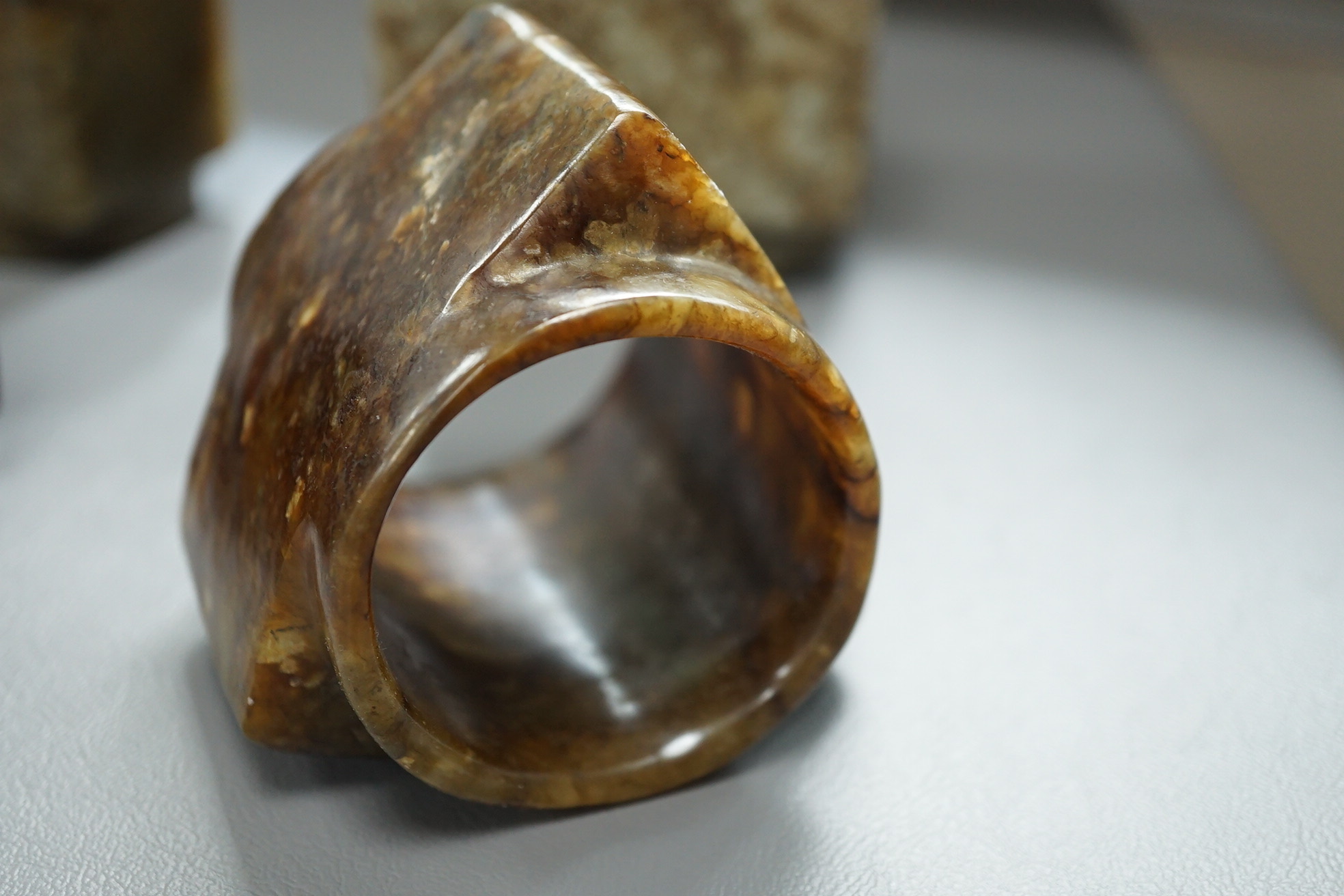 Four Chinese archaistic jade or hardstone cong